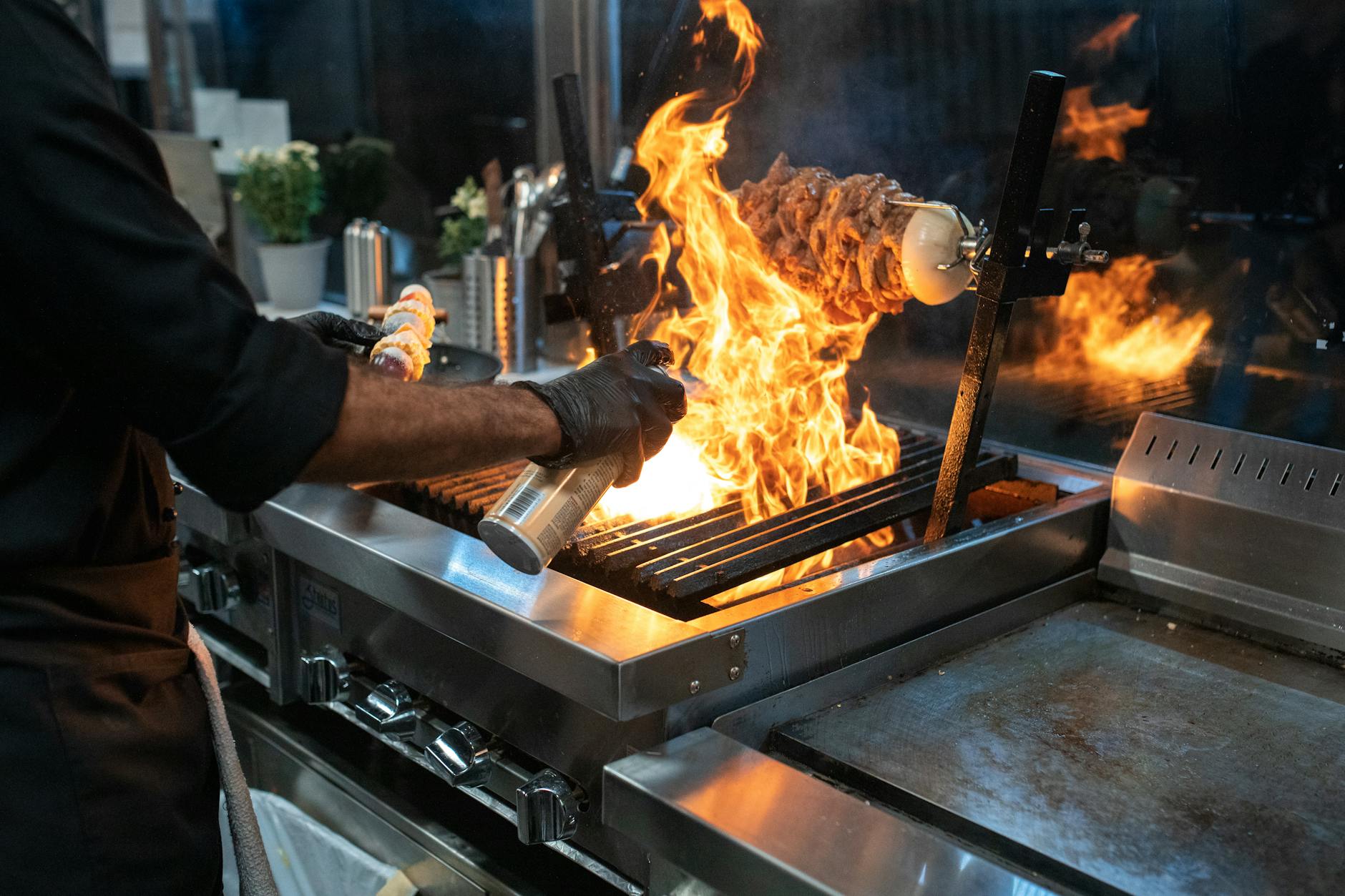 a person cooking on the grill